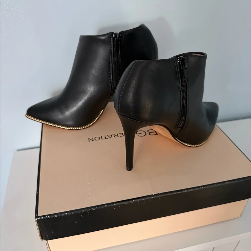 BCBG Black Leather Pointed Stiletto Ankle Booties with Gold Trim - Picture 2 of 5